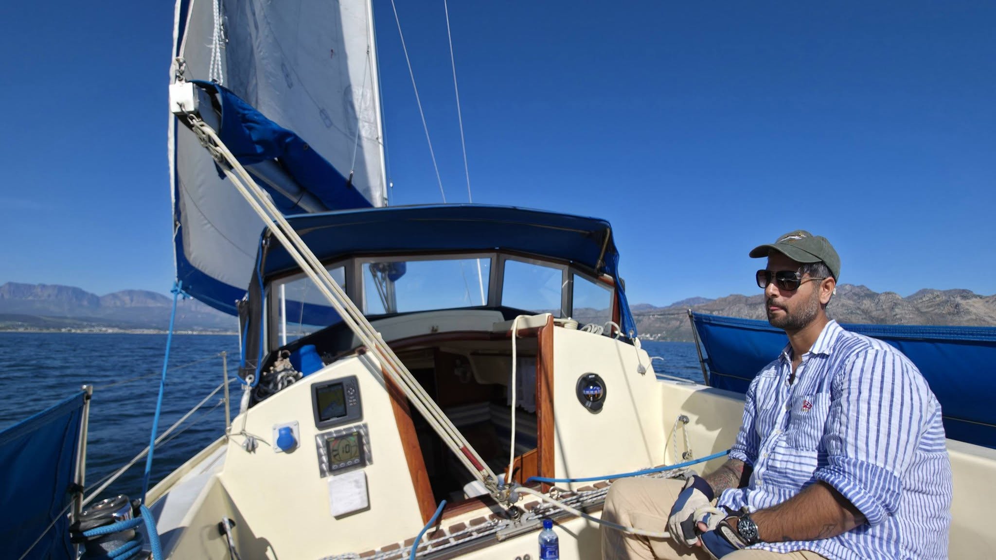 Helming a keelboat in False Bay