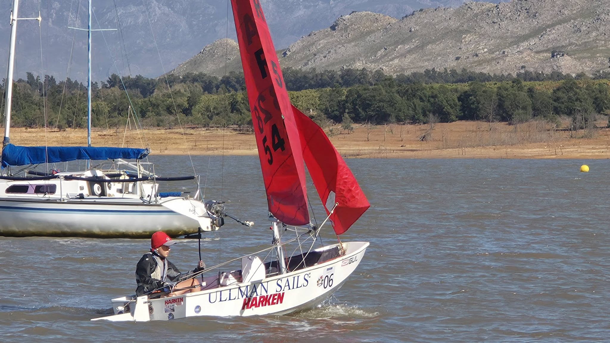 Topaz dinghy flying a red gennaker on Theewaterskloof Dam