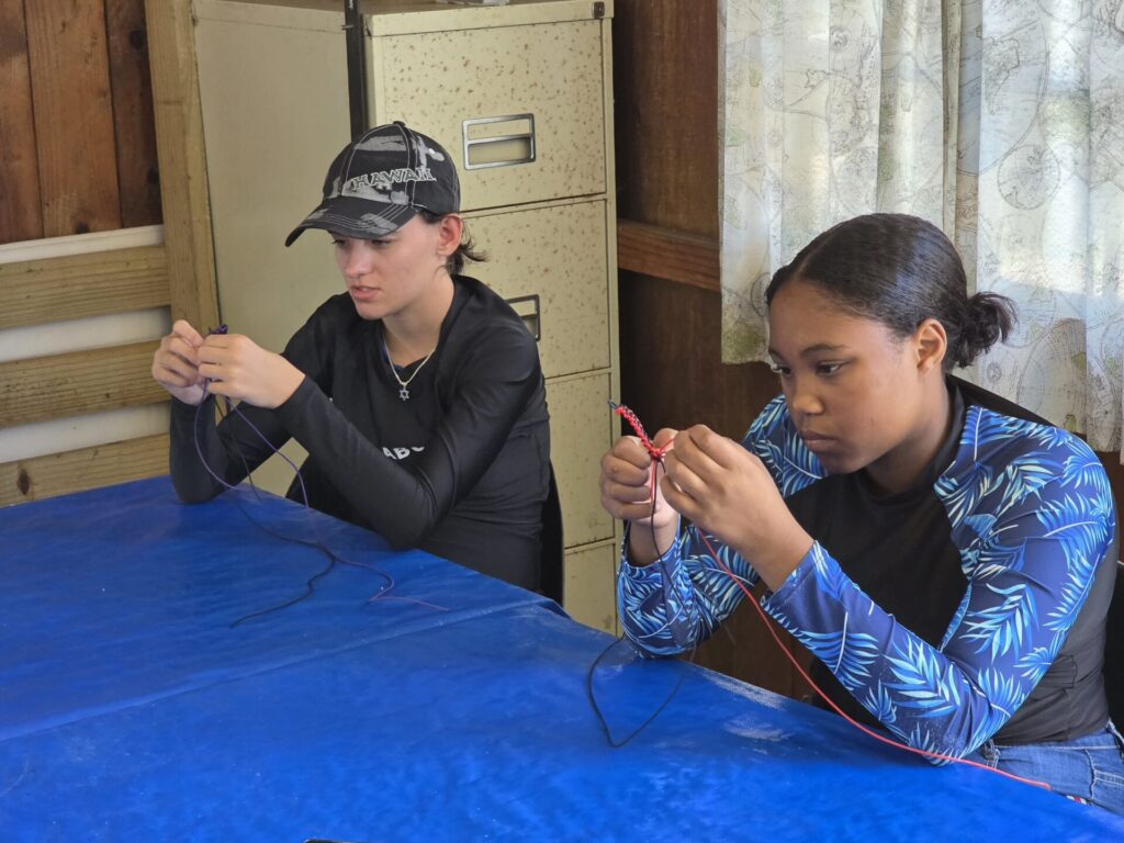 Youth dinghy sailing camps Cape Town - Making rope bracelets